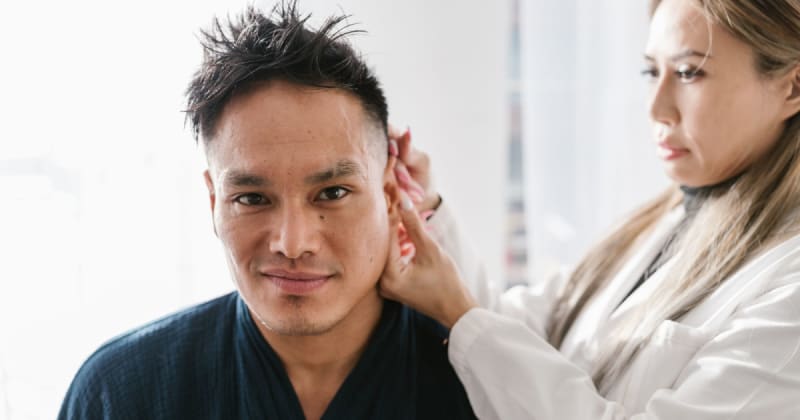 Doctors dismissed a ring-sized green spot on man's ear as 'scar tissue' for 20 years — until a routine X-Ray accidentally solved the mystery