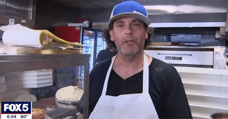 Woman sifting through pizzeria's trash reminded owner of mom's advice. The sign he put up is going viral