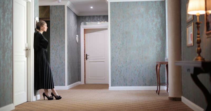 Her husband left birthing class early for a hotel reservation he kept secret. She followed, got a room key and waited outside his door