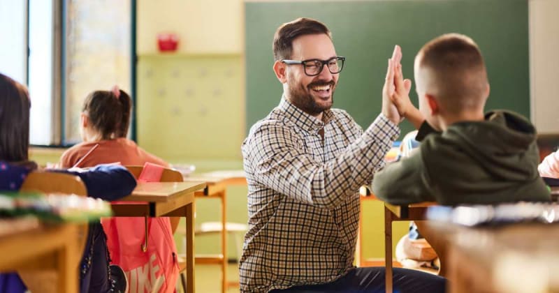 Students discovered their teacher was in a band. Then they learned his song and surprised him mid-class